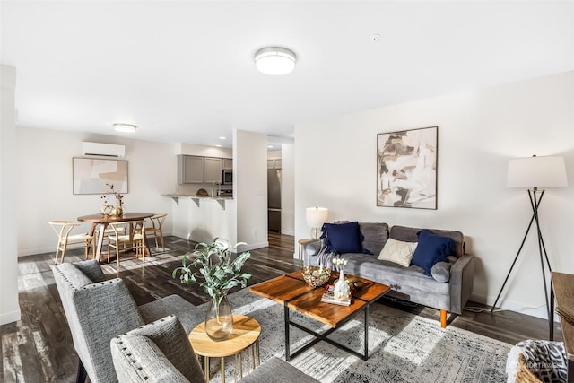 living room featuring dark hardwood / wood-style flooring, a wall mounted AC, and sink