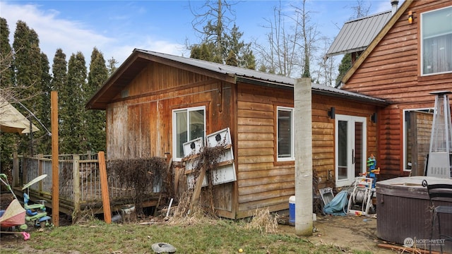 view of side of home featuring a wooden deck and central air condition unit