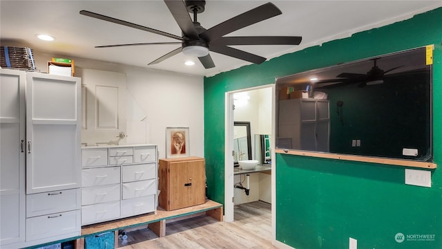 interior space with light hardwood / wood-style flooring and ceiling fan