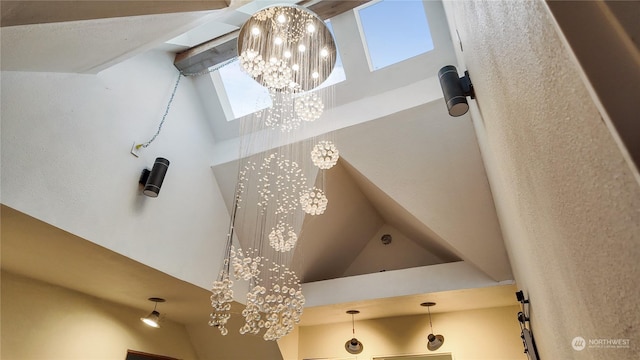 bathroom featuring a high ceiling and a chandelier