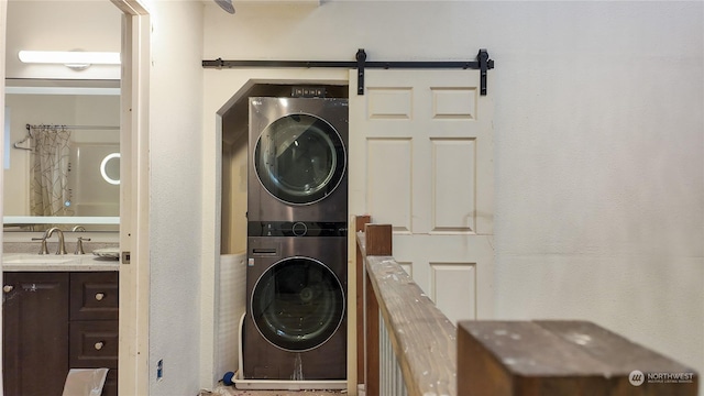 laundry room with sink and stacked washing maching and dryer