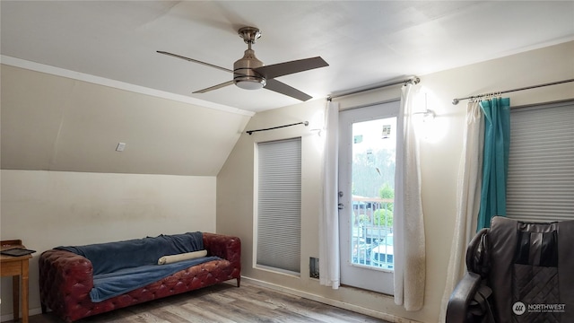 interior space with ceiling fan, light hardwood / wood-style floors, and vaulted ceiling