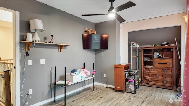 interior space featuring ceiling fan and light wood-type flooring