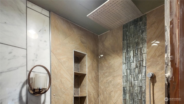 interior details with a tile shower