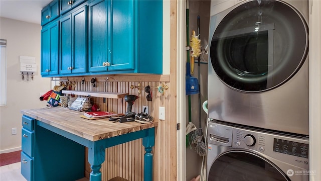 washroom with stacked washer / drying machine