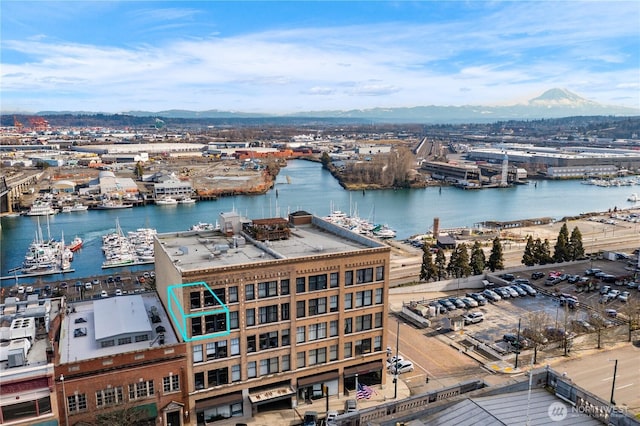 aerial view featuring a water and mountain view