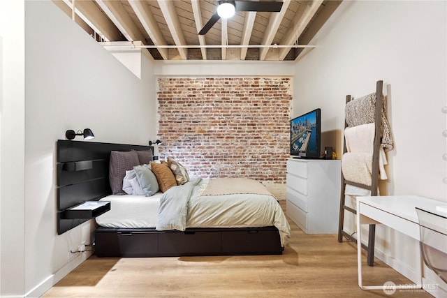 bedroom with beamed ceiling, brick wall, hardwood / wood-style floors, and wood ceiling