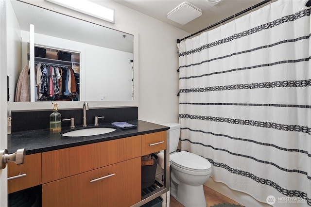 bathroom with vanity and toilet