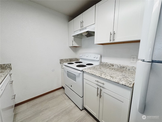 kitchen featuring white cabinetry, white appliances, light stone countertops, and light wood-type flooring