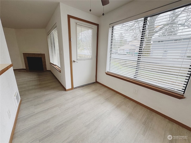 entryway with light hardwood / wood-style floors and ceiling fan