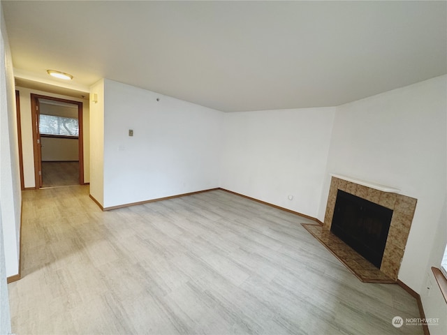 unfurnished living room with light wood-type flooring