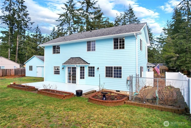 back of house with roof with shingles, a patio area, a yard, and fence