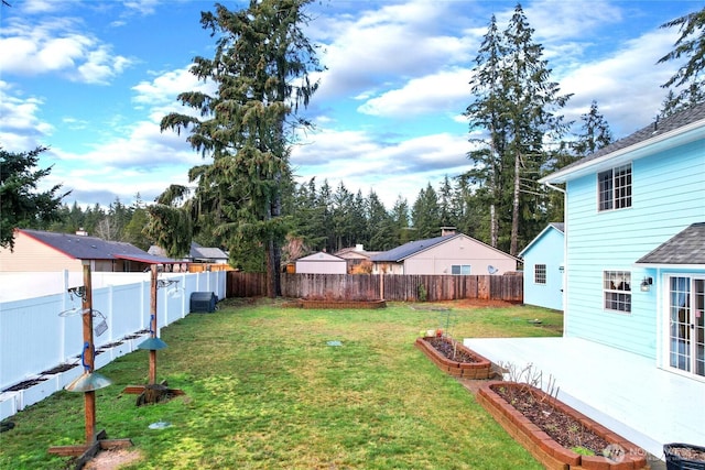 view of yard with a fenced backyard