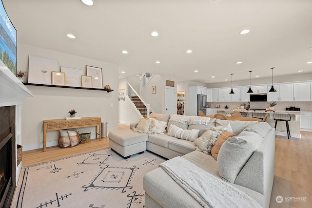 living room with light hardwood / wood-style flooring