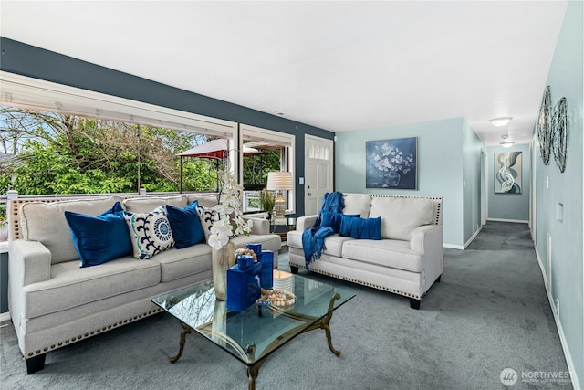 carpeted living area with baseboards