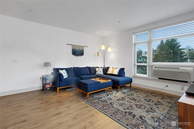 living room with cooling unit and wood-type flooring