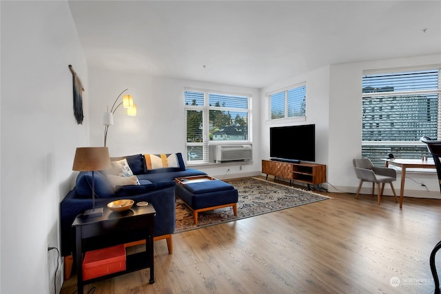 living room featuring hardwood / wood-style floors and cooling unit