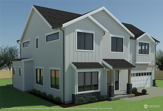 view of front of property featuring a garage and a front yard