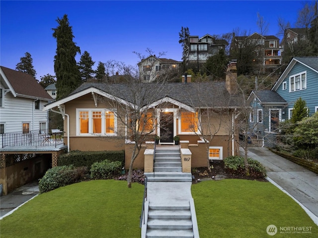 view of front of property featuring a residential view and a front yard