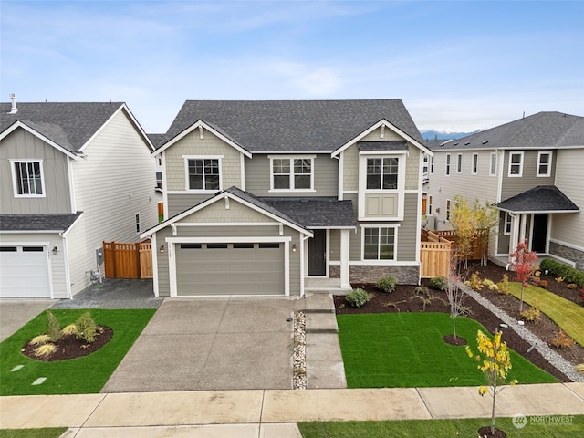 view of front facade with a garage and a front lawn