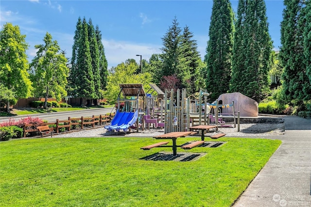 view of playground featuring a lawn