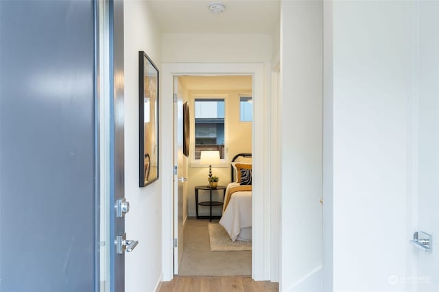 hallway with light wood-type flooring