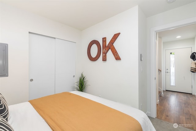 bedroom featuring hardwood / wood-style flooring and a closet