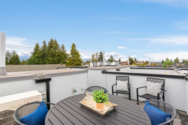 deck featuring exterior kitchen and ac unit