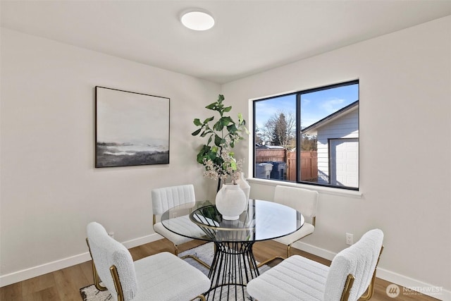 dining space featuring hardwood / wood-style flooring