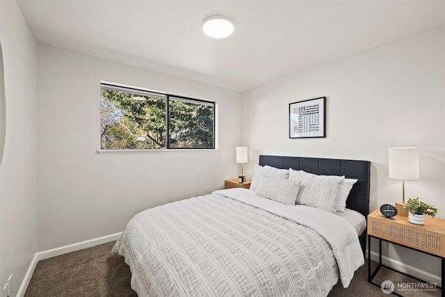 bedroom with dark carpet