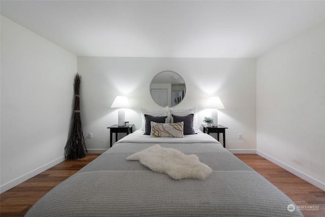 bedroom with wood-type flooring