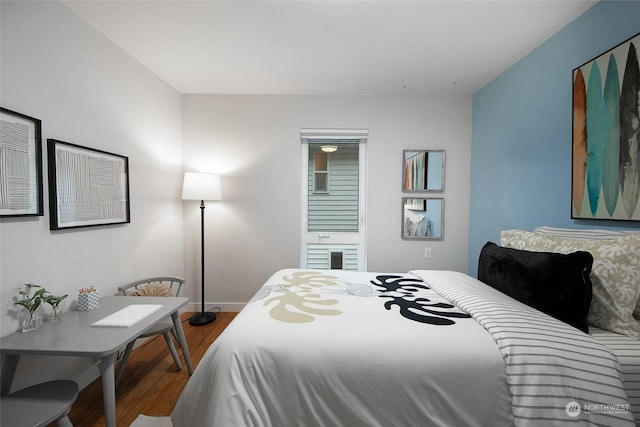 bedroom featuring wood-type flooring