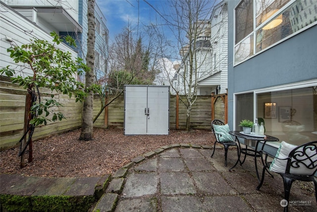 view of patio / terrace with a storage shed