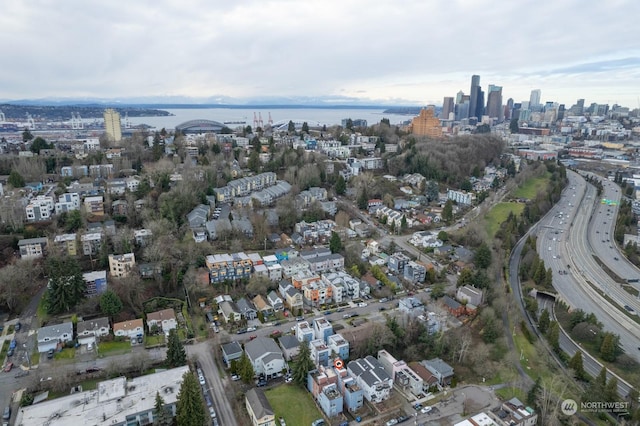 birds eye view of property with a water view