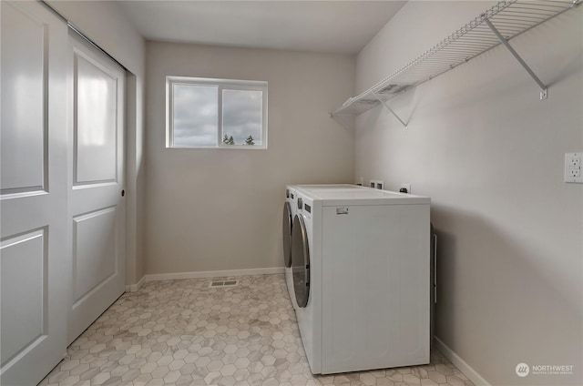 laundry area featuring washing machine and dryer