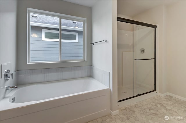 bathroom featuring tile patterned floors and plus walk in shower