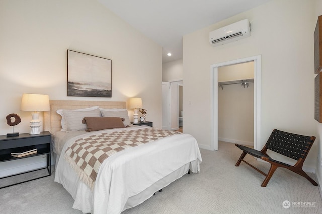 bedroom with light carpet, a wall mounted AC, and a closet