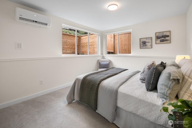 bedroom featuring carpet flooring and an AC wall unit