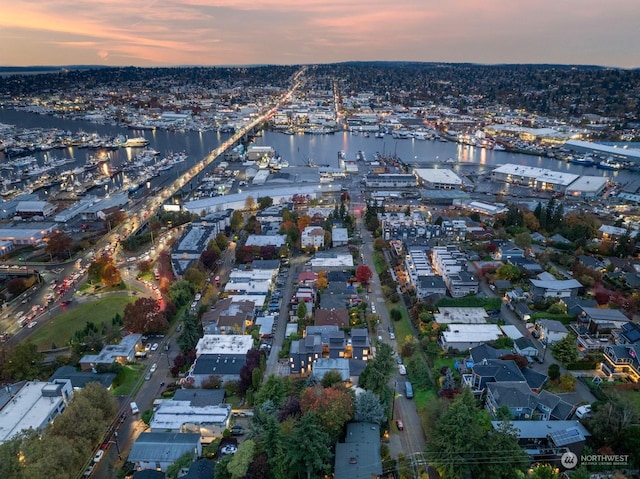 aerial view at dusk with a water view