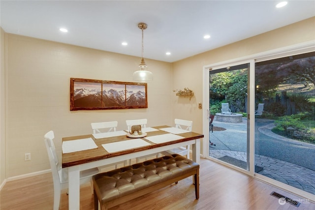 dining area with hardwood / wood-style flooring