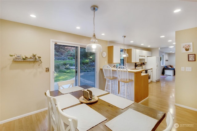 dining area featuring light hardwood / wood-style flooring