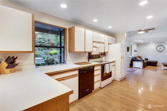 kitchen with sink, white appliances, light hardwood / wood-style flooring, ceiling fan, and white cabinets