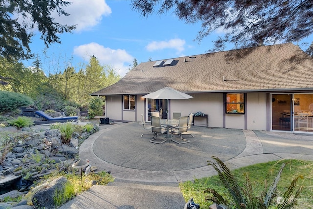 rear view of property with a patio