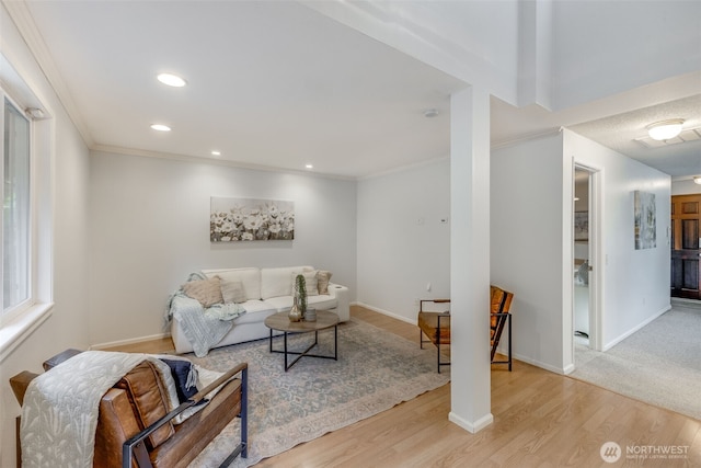 9230 119th St E, Puyallup, WA 98373 - living room with crown molding, baseboards, and wood finished floors