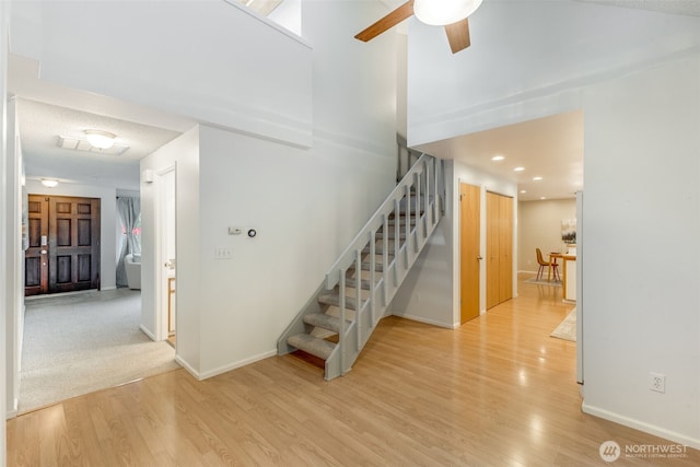 9230 119th St E, Puyallup, WA 98373 - staircase featuring wood finished floors, baseboards, ceiling fan, and recessed lighting