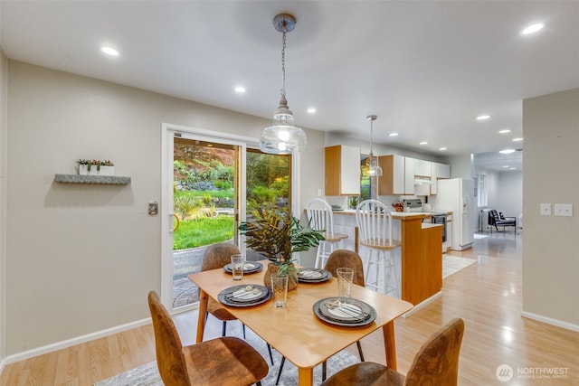 9230 119th St E, Puyallup, WA 98373 - dining area featuring recessed lighting, baseboards, and light wood finished floors