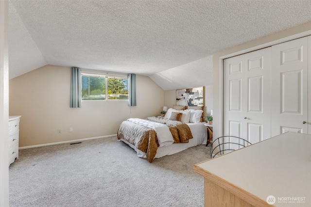 9230 119th St E, Puyallup, WA 98373 - bedroom with carpet, baseboards, lofted ceiling, visible vents, and a closet