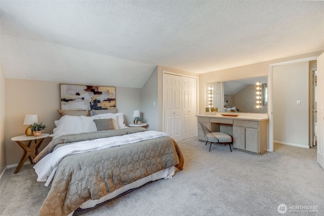 9230 119th St E, Puyallup, WA 98373 - bedroom with a textured ceiling, light colored carpet, baseboards, a closet, and lofted ceiling