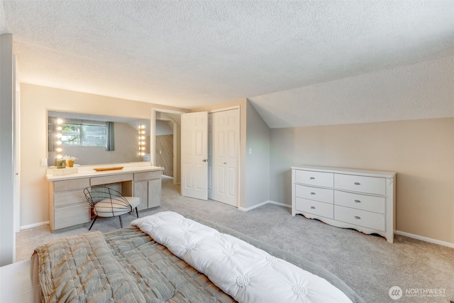 9230 119th St E, Puyallup, WA 98373 - bedroom featuring light carpet, a textured ceiling, and a closet