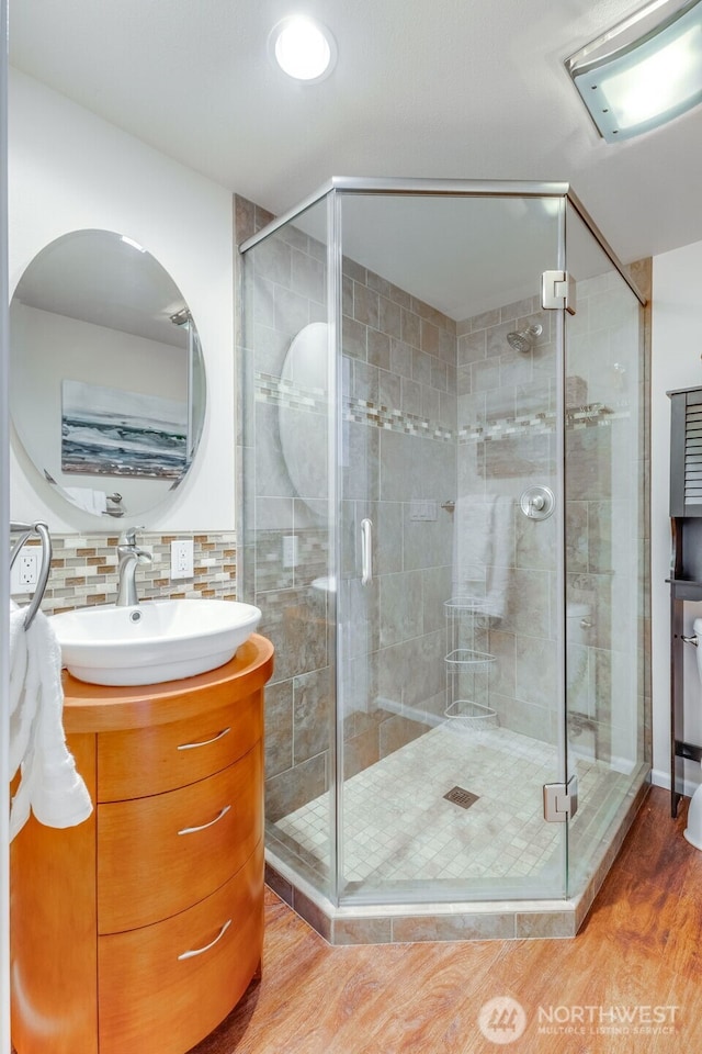 9230 119th St E, Puyallup, WA 98373 - full bath with a stall shower, vanity, and wood finished floors